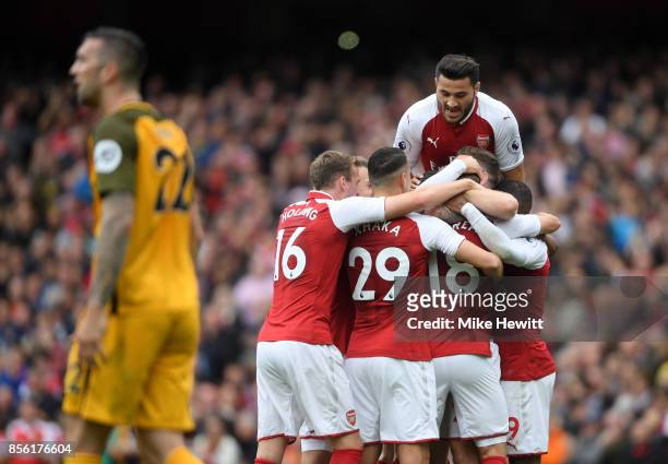 Nacho Monreal of Arsenal celebrates scoring his sides first goal with his Arsenal team mates during the Premier League match between Arsenal and...
