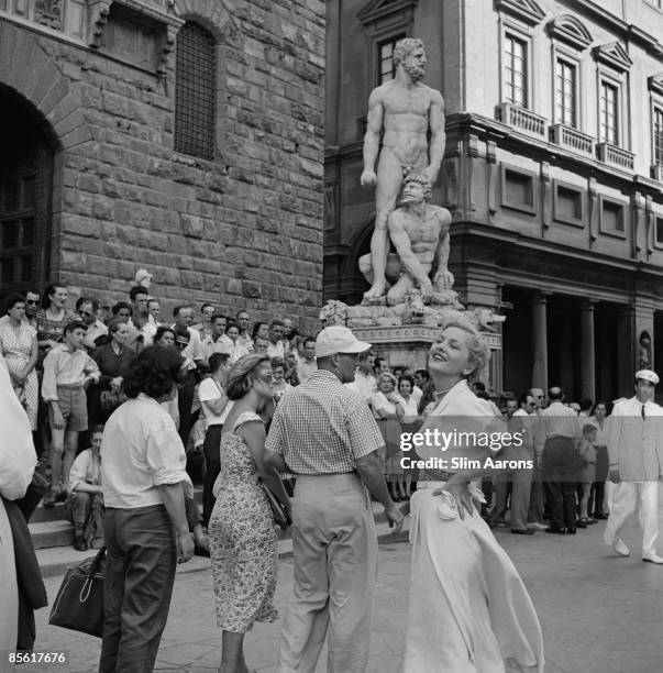 Actress Joan Fontaine poses in the Piazza della Signoria, Florence, Italy, during the location filming of 'September Affair', August 1949.