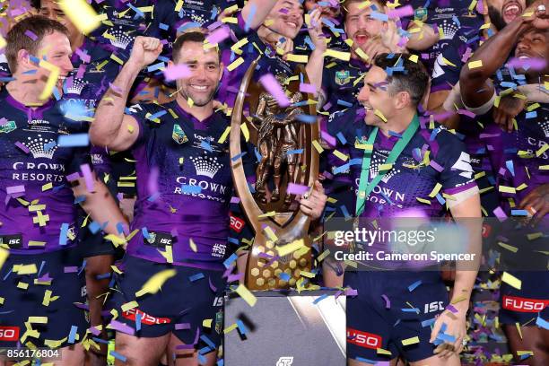 The Storm celebrate with the Provan-Summons Trophy after winning the 2017 NRL Grand Final match between the Melbourne Storm and the North Queensland...