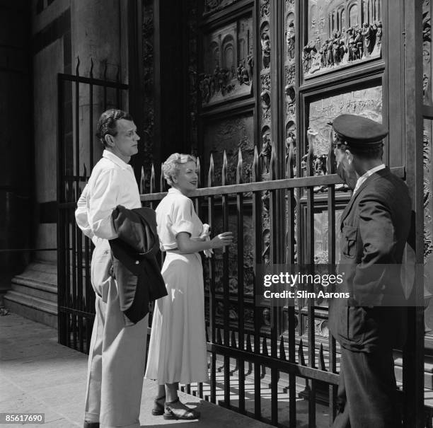 Actors Joseph Cotten and Joan Fontaine in Florence, Italy, during the location filming of 'September Affair', August 1949. They are standing in front...