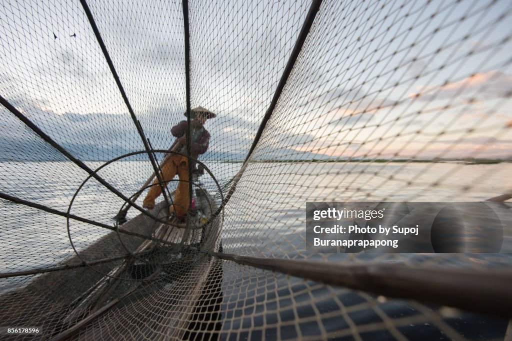 Inle Leg-rowing fishermen with traditional fishing at Inle Lake, Myanmar