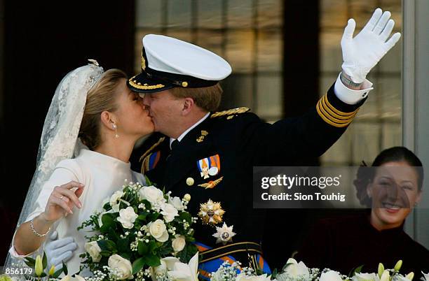 Dutch Crown Prince Willem Alexander and his new bride Crown Princess Maxima Zorreguieta kiss after their wedding February 2, 2002 on the balcony of...