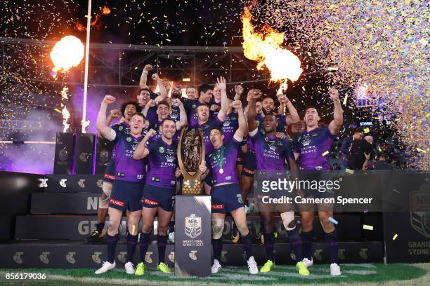 The Storm celebrate with the Provan-Summons Trophy after winning the 2017 NRL Grand Final match between the Melbourne Storm and the North Queensland...