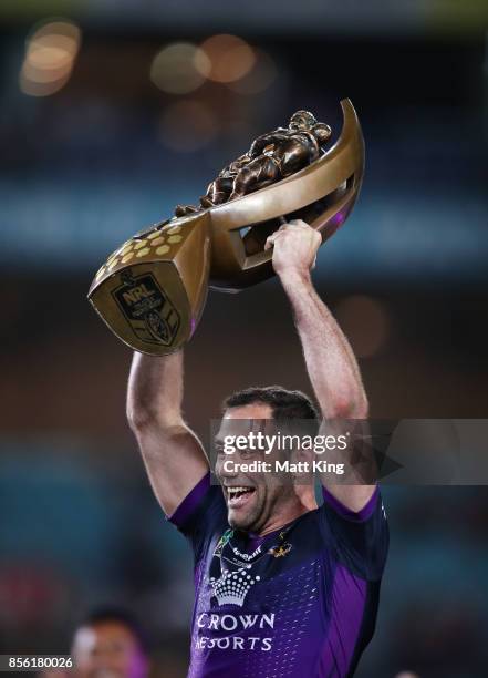 Cameron Smith of the Storm celebrates and holds aloft the NRL Premiership trophy after victory in the 2017 NRL Grand Final match between the...