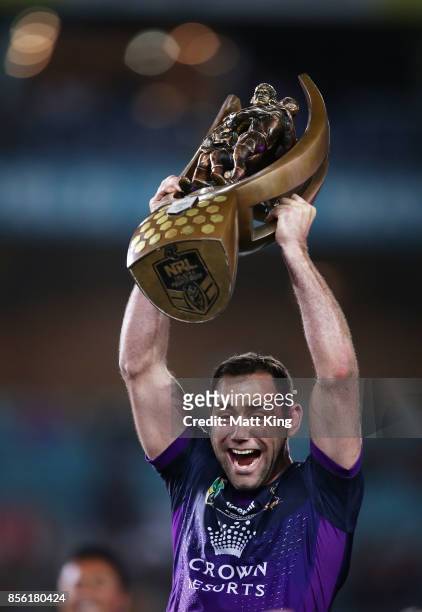 Cameron Smith of the Storm celebrates and holds aloft the NRL Premiership trophy after victory in the 2017 NRL Grand Final match between the...