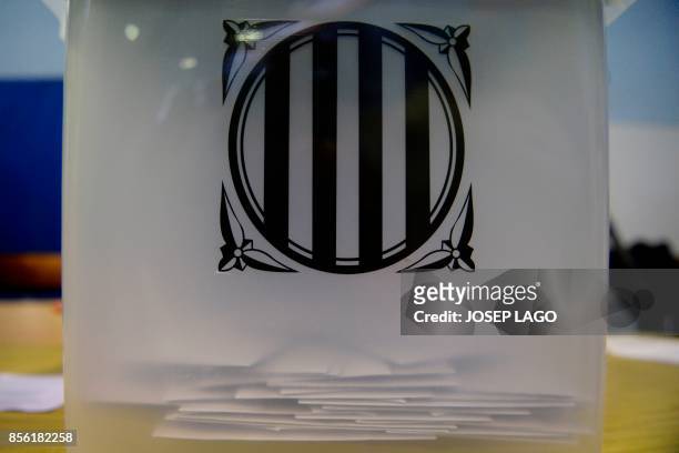 Ballots are pictured inside a ballot box at a polling station in Barcelona, on October 01 during a referendum on independence for Catalonia banned by...