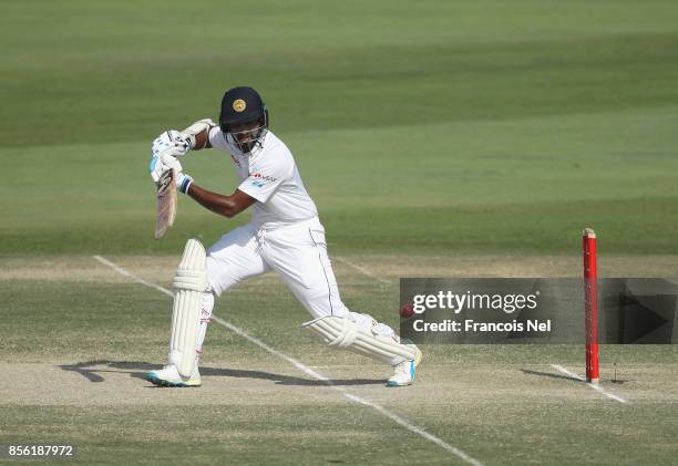 Dimuth Karunaratne of Sri Lanka bats during Day Four of the First Test between Pakistan and Sri Lanka at Sheikh Zayed stadium on October 1, 2017 in...