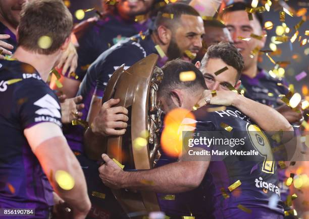 Cameron Smith and Billy Slater of the Storm celebrate with the NRL Premiership trophy after winning the 2017 NRL Grand Final match between the...