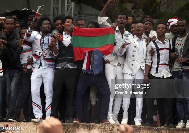 Thousands of Oromo people stage a protest and shout slogans against government as they attend the "Irreecha" festival also known as Oromo...