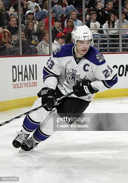 Dustin Brown of the Los Angeles Kings skates around the boards during a game against the Chicago Blackhawks on March 22, 2009 at the United Center in...