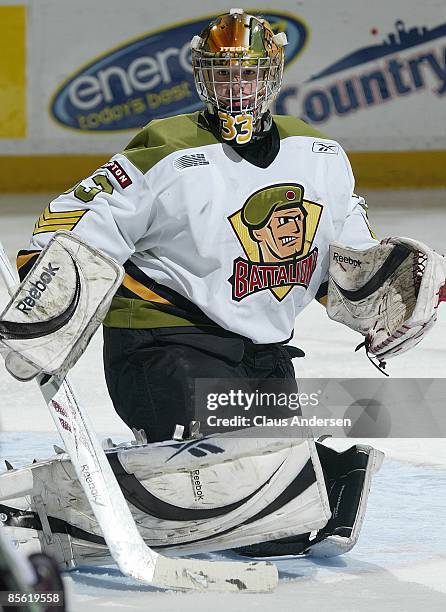 Thomas McCollum of the Brampton Battalion keeps an eye on the play in the 3rd game of the opening round eastern conference series against the...