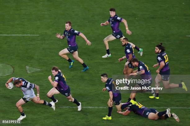 Kyle Feldt of the Cowboys makes a break during the 2017 NRL Grand Final match between the Melbourne Storm and the North Queensland Cowboys at ANZ...