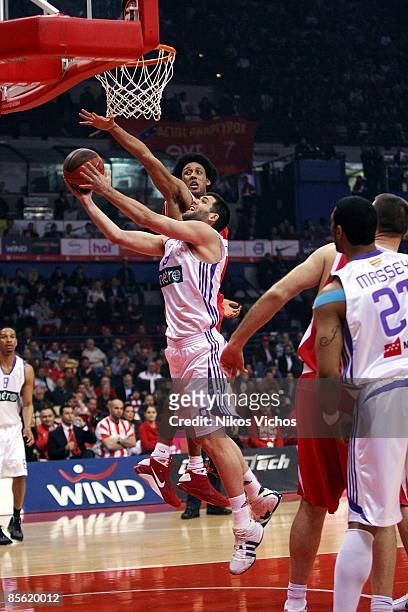 Felipe Reyes, #9 of Real Madrid competes with Josh Childress, #6 of Olympiacos during the Play off Game 2 Olympiacos Piraeus v Real Madrid on March...