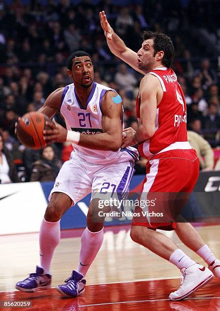 Jeremiah Massey, #21 of Real Madrid competes with Theo Papaloukas, #4 of Olympiacos during the Play off Game 2 Olympiacos Piraeus v Real Madrid on...