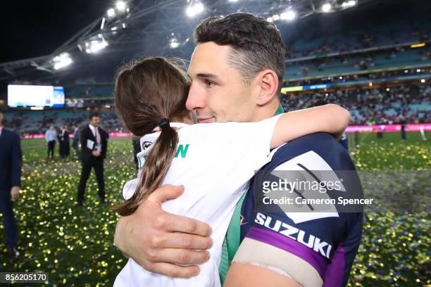 Billy Slater of the Storm celebrates with his daughter after winning the 2017 NRL Grand Final match between the Melbourne Storm and the North...
