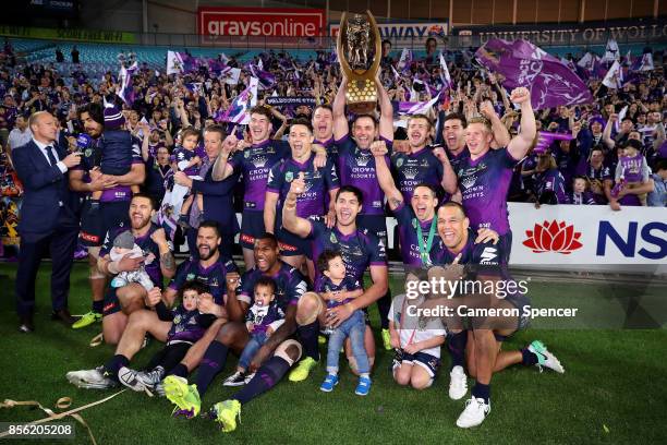 The Storm celebrate with the Provan-Summons Trophy after winning the 2017 NRL Grand Final match between the Melbourne Storm and the North Queensland...