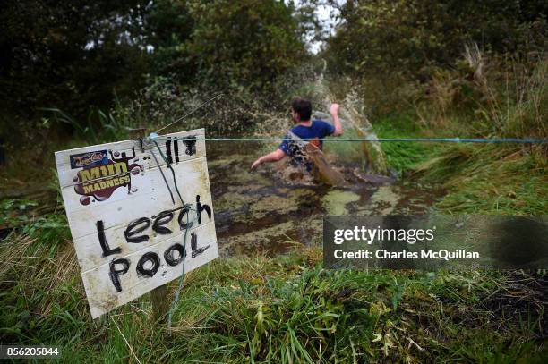 Competitor jumps into the 'Leech Pool' during the McVities Jaffa Cakes Mud Madness race in association with charity partner Marie Curie at Foymore...