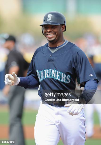 Ken Griffey Jr. #24 of the Seattle Mariners looks on from first base during a Spring Training game against the Arizona Diamondbacks at Peoria Stadium...