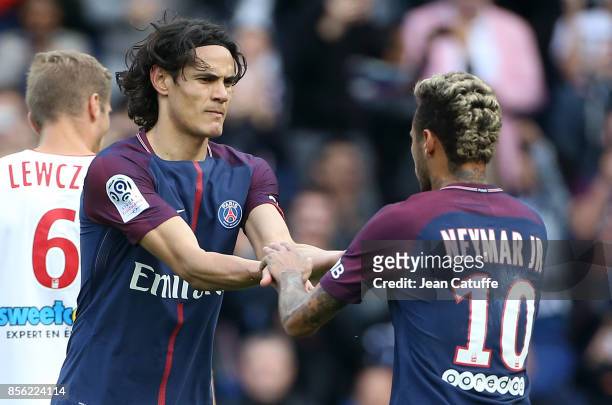 Neymar Jr of PSG celebrates his second goal with Edinson Cavani during the French Ligue 1 match between Paris Saint-Germain and FC Girondins de...