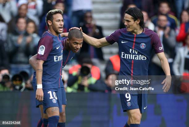 Kylian Mbappe of PSG celebrates his goal between Neymar Jr and Edinson Cavani during the French Ligue 1 match between Paris Saint-Germain and FC...