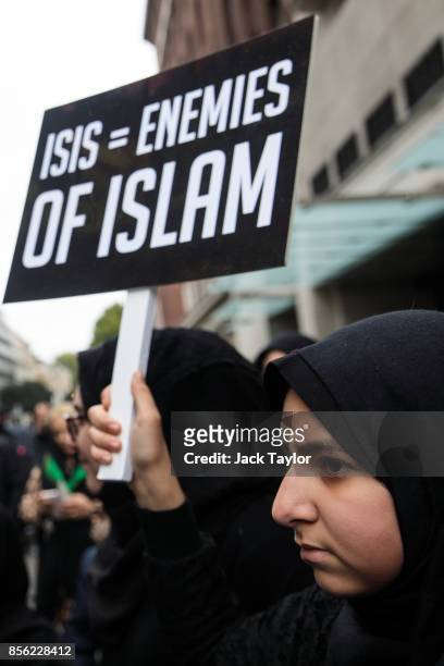 Protester holds a placard during the annual Ashura march in Marble Arch on October 1, 2017 in London, England. Hundreds of protesters march through...