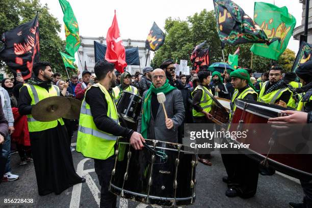 Drums are played as protesters gather with flags and placards ahead of the annual Ashura march in Marble Arch on October 1, 2017 in London, England....