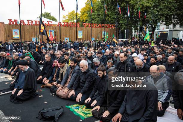 Muslims prey ahead of the annual Ashura march in Marble Arch on October 1, 2017 in London, England. Hundreds of protesters march through London today...