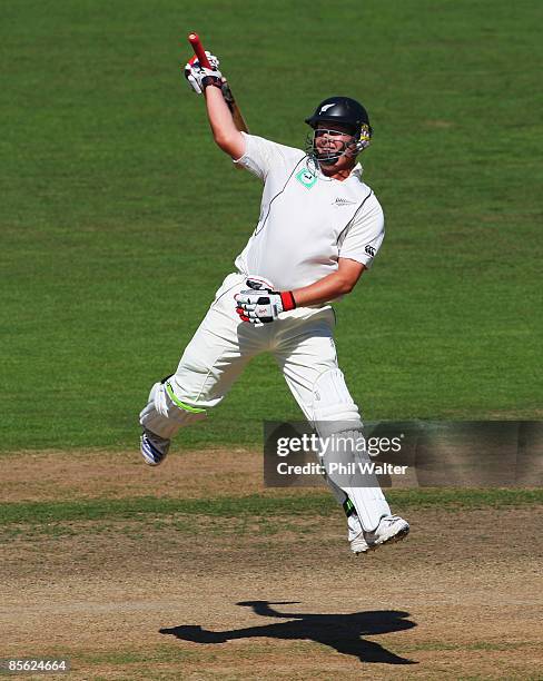 Jesse Ryder of New Zealand leaps in the air as he celebrates his 200 runs during day two of the second test match between New Zealand and India at...