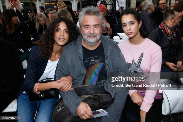 Luc Besson sitting between his nieces Noemie Lenoir and Iman Perez attend "Le Defile L'Oreal Paris show" as part of the Paris Fashion Week Womenswear...