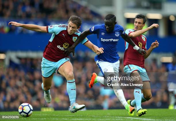 James Tarkowski of Burnley and Jack Cork of Burnley attempt to tackle Oumar Niasse of Everton during the Premier League match between Everton and...