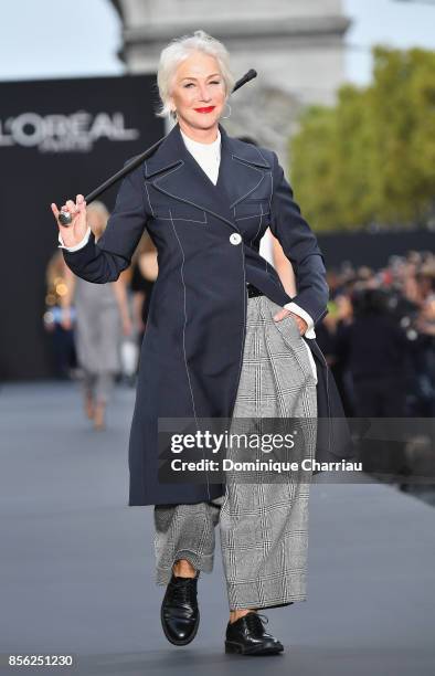 Helen Mirren walks the runway during the Le Defile L'Oreal Paris show as part of the Paris Fashion Week Womenswear Spring/Summer 2018 on October 1,...