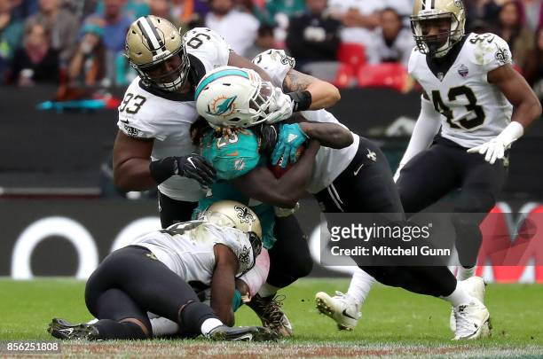 Miami Dolphins running back Jay Ajayi gets tackled by 3 New Orleans Saints players during the NFL match between the Miami Dolphins and the New...