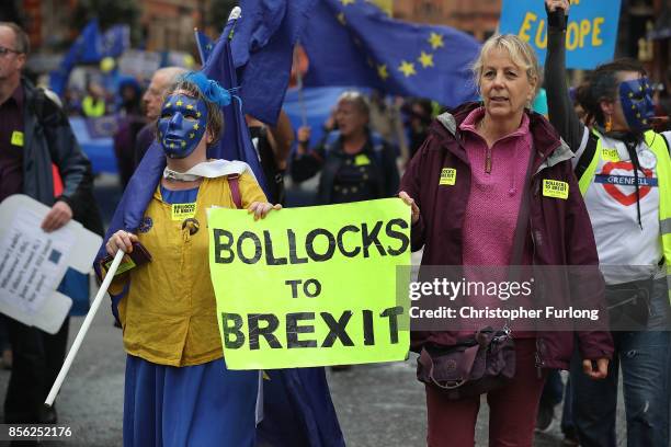 An anti-Brexit sign is held up as anti-Brexit and anti-austerity activists take part in protests as the Conservative party annual conference gets...