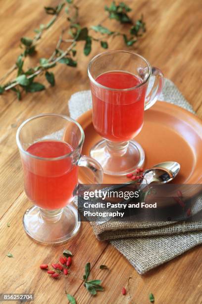 two cups of hot berberis tea - famiglia delle berberidacee foto e immagini stock