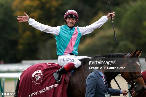 Jockey Frankie Dettori, on his horse Enable, reacts as he celebrates winning the 96th Qatar Prix de l'Arc de Triomphe horse race at the Chantilly...