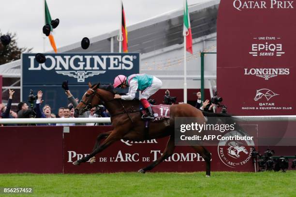 Jockey Frankie Dettori, on his horse Enable, races to win the 96th Qatar Prix de l'Arc de Triomphe horse race at the Chantilly racecourse, north of...