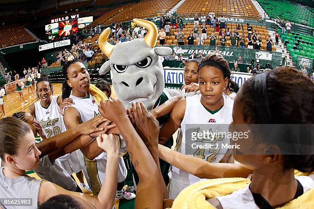 The South Florida Bulls celebrate their victory in the Women's National Invitational Tournament game over the Mississippi Rebels at the USF Sun Dome...