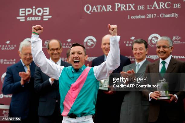 Italian Jockey Lanfranco Dettori aka Frankie Dettori, reacts as he celebrates on the podium during the price ceremony after winning the 96th Qatar...
