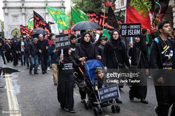 Protesters gather with placards during the annual Ashura march in Marble Arch on October 1, 2017 in London, England. Thousands of protesters march...