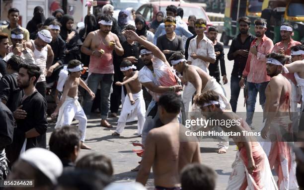 Muslim devotees take part in a mourning procession marking the day of Ashura, 10 Muharram-ul-Haram, at Shia Jama Masjid Kashmiri Gate, on October 1,...