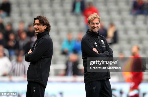 Jurgen Klopp, Manager of Liverpool speaks to Zeljko Buvac, Liverpool assistant manager prior to the Premier League match between Newcastle United and...