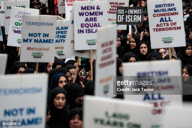 Protesters holding placards demonstrate along Oxford Street during the annual Ashura march on October 1, 2017 in London, England. Thousands of...
