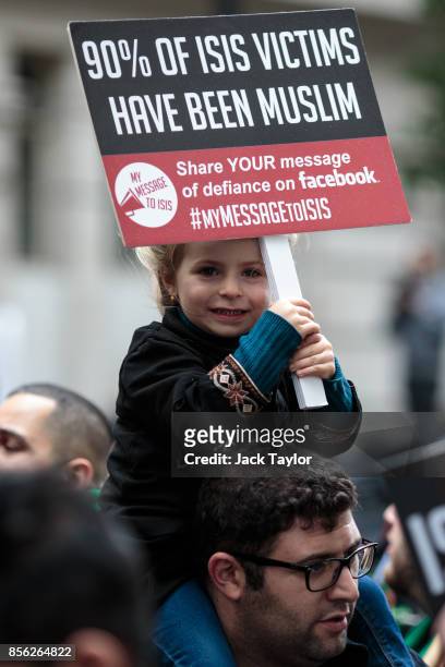 Young protester holds up a placard ahead of the annual Ashura march in Marble Arch on October 1, 2017 in London, England. Thousands of protesters...
