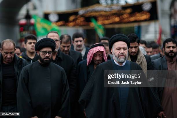 Muslims prey ahead of the annual Ashura march in Marble Arch on October 1, 2017 in London, England. Thousands of protesters march through London...