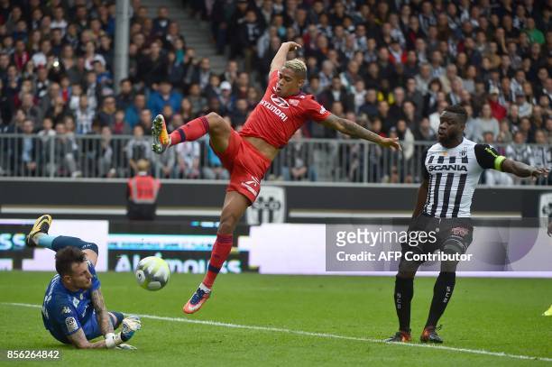 Lyon's Spanish forward Mariano Diaz vies with Angers' French goalkeeper Alexandre Letellier and Angers' Ivorian defender Ismael Traore during the...