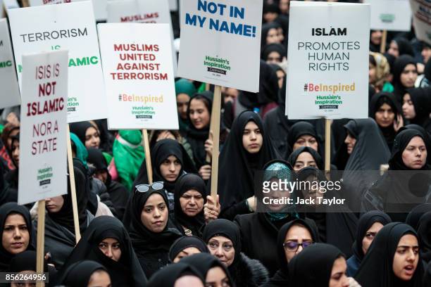 Protesters holding placards demonstrate along Oxford Street during the annual Ashura march on October 1, 2017 in London, England. Thousands of...