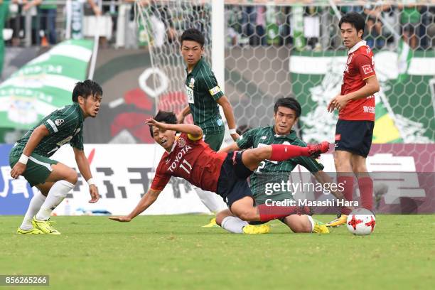 Hisato Sato of Nagoya Grampus and Masanori Abe of FC Gifu compete for the ball during the J.League J2 match between FC GIfu and Nagoya Grampus at...