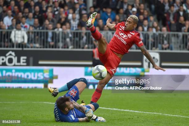 Lyon's Spanish forward Mariano Diaz vies with Angers' French goalkeeper Alexandre Letellier during the French L1 football match between Angers and...