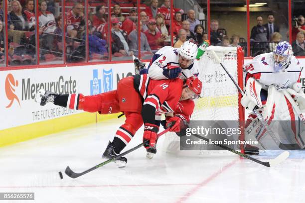 Carolina Hurricanes right wing Justin Williams and Washington Capitals defenseman Matt Niskanen during the 1st period of the Carolina Hurricanes game...