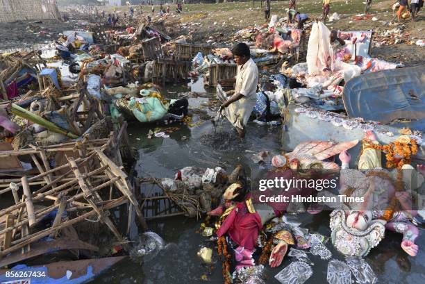 Water pollution due to immersion of Goddess Durga idols after the celebration of 9-day long festival of Durga Puja at Yamuna River Bank near ISBT, on...